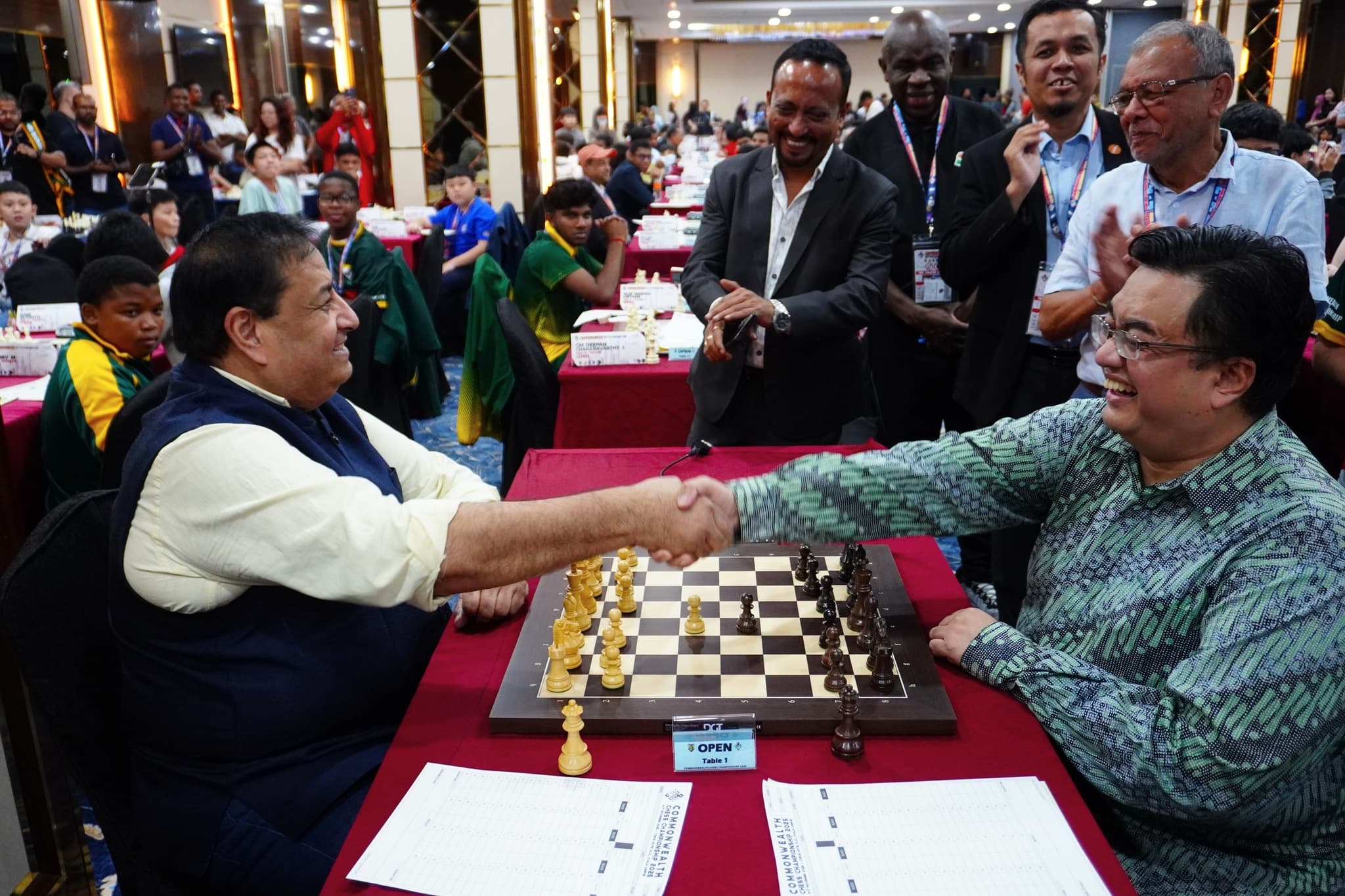 Opening Ceremony Game between President of the Commonwealth Chess Association, Mr. Bharat Singh (left), and the President of the Malaysian Chess Federation, Mr. Akhramsyah Muammar (right)